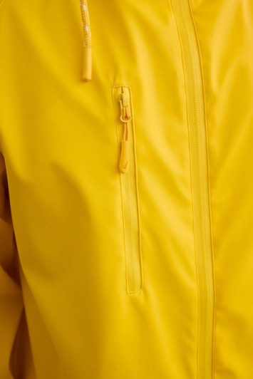 A bright yellow unisex raincoat featuring a front zip and a zippered pocket. It has a logo on the fabric.
