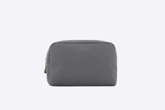 A grey zipper bag with a simple, minimalist design and a logo on the side.
