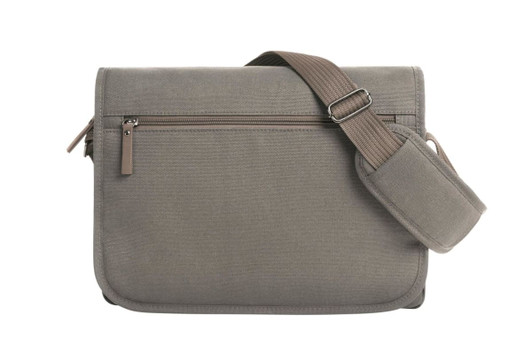 A shoulder bag in a muted grey colour with an adjustable strap and a zippered front pocket.