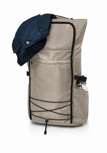 A beige laptop backpack with a navy jacket draped over it, featuring a side water bottle pocket and a front pouch.