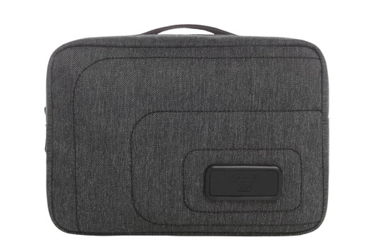 A grey toiletry bag with a textured finish and a logo on the front, featuring a zip closure and a handle.