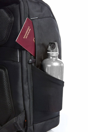 A black backpack featuring an outer pocket with a stainless steel drink bottle and a passport partially visible.