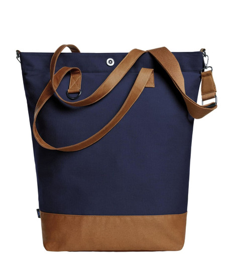 A navy blue tote bag with a brown base and a shoulder strap. It features a branded logo.