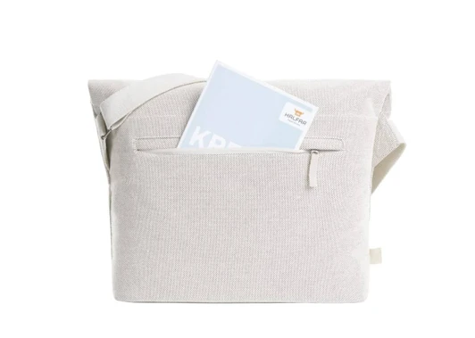 A light grey satchel bag with a shoulder strap and a front pocket, holding a document or notebook inside.