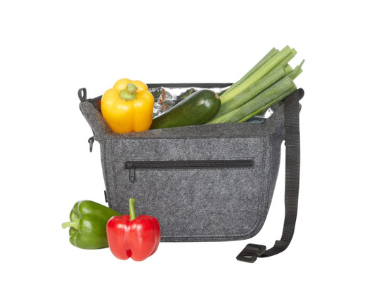 A grey felt lunch bag with a zippered pocket, filled with yellow, green, and red peppers, and a zucchini.