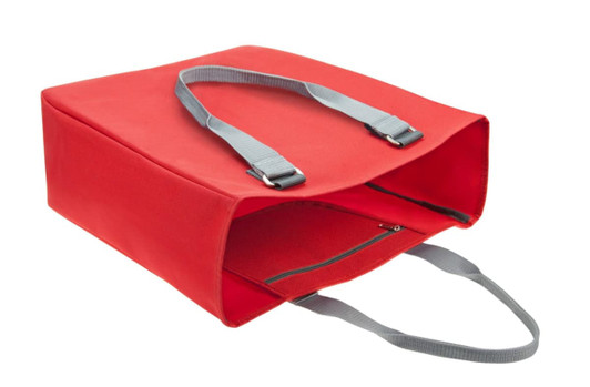 A red reusable grocery bag with grey straps and a zippered opening. It has a simple design and includes a logo.