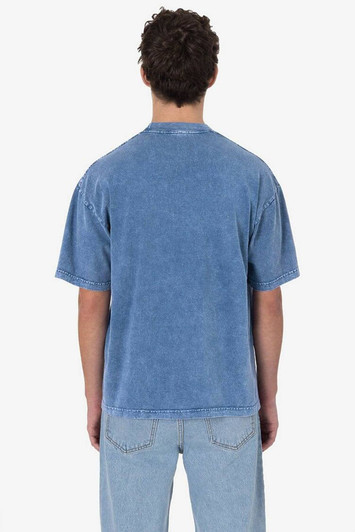 A blue short sleeve crew tee with a mineral wash finish, featuring a casual design and a logo.