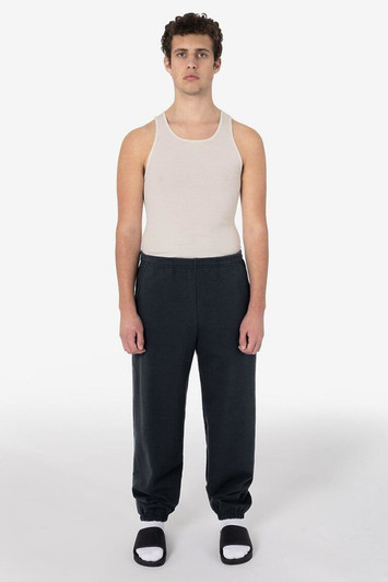 Heavy fleece sweatpants in dark grey, paired with a plain tank top and black sandals.