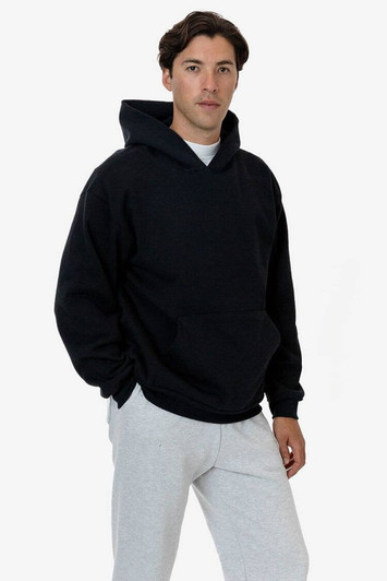A heavy fleece hood pullover in navy blue, worn by a model, featuring a front pocket and a hood.