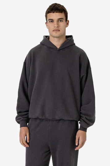 A dark grey garment dye plush fleece pullover hoodie with a hood, featuring a relaxed fit and long sleeves.