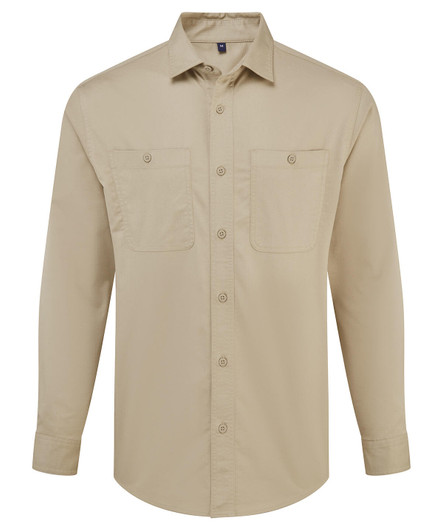 A beige button-up shirt with long sleeves and two chest pockets. It features a logo on the chest.