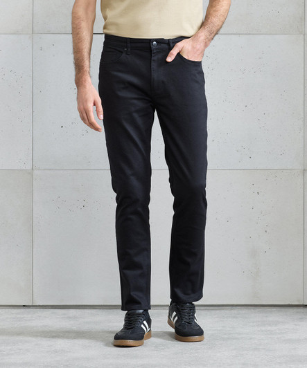 Black straight-leg jeans displayed on a model against a light grey background, featuring a branding logo.