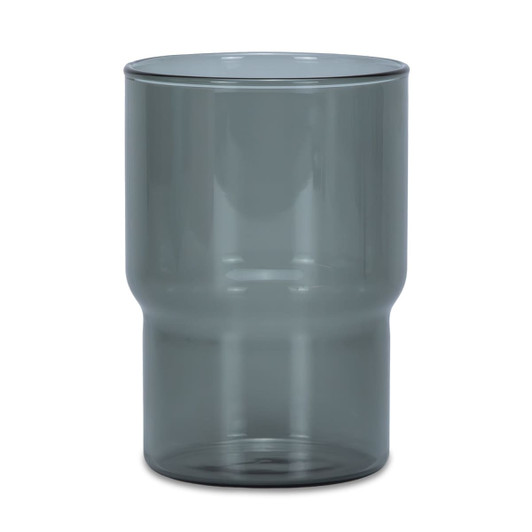 A drink tumbler in a transparent smokey grey colour with a distinctive curved design. Includes a logo.