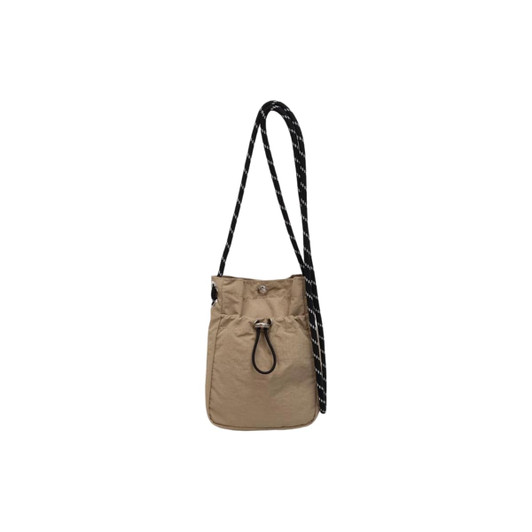 A lightweight shoulder phone bag in tan, featuring a drawstring closure and a black-and-white patterned strap.