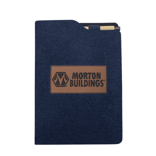 A navy notebook with a textured cover and a brown leather logo patch. It has a folder-style design.