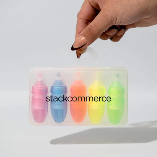 A set of five highlighters in pink, orange, blue, green, and yellow, contained in a transparent plastic case with a handle.
