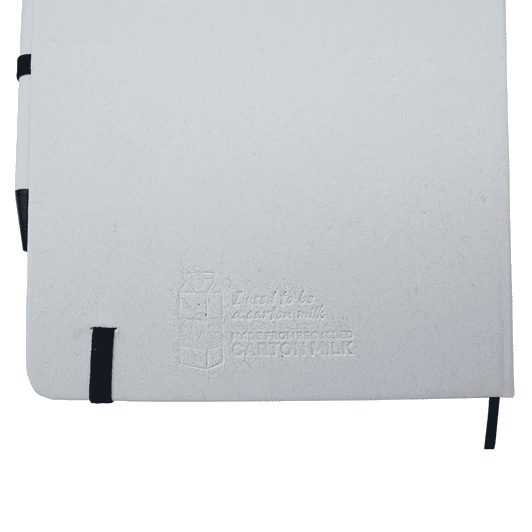 A white A5 notebook with a black elastic band and a black pen, featuring a subtle embossed logo.