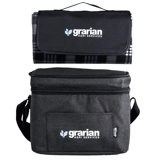 A black and grey cooler bag with a matching picnic blanket on top, featuring a logo.