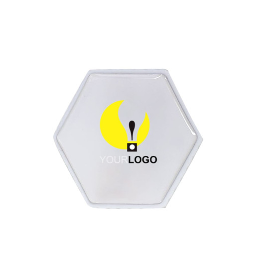 A hexagon-shaped flash drive in a clear design with a logo.