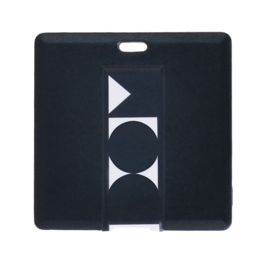 A square black flash drive featuring a simple geometric design and a small logo.