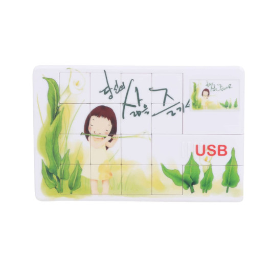 A puzzle-shaped USB flash drive with a colourful design featuring a girl amidst flowers and greenery.