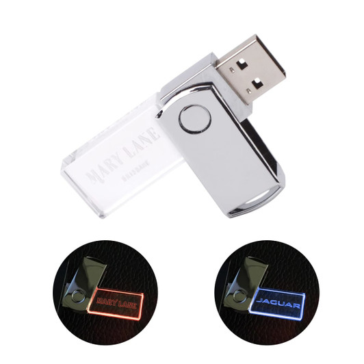 A silver swivel flash drive with a crystal body, featuring logos on both sides.