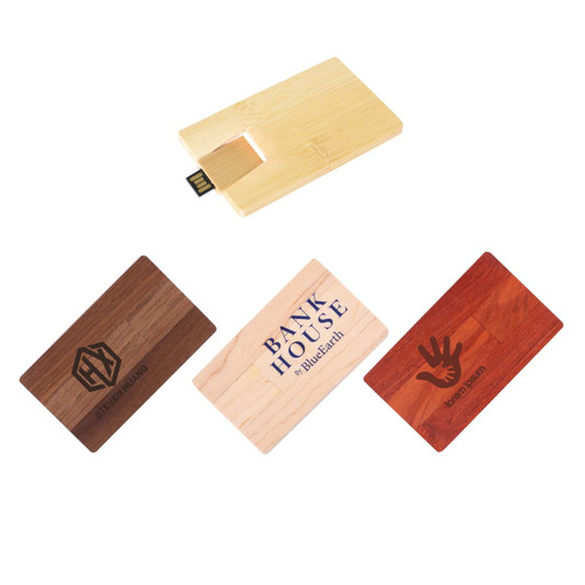 A collection of wooden credit card flash drives in various shades, featuring different designs and a USB connector.