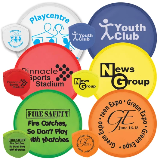 A collection of colorful flying discs in various sizes and designs, featuring multiple logos and branding.