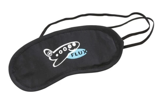 A black eye mask with a light blue airplane graphic and an elastic strap for a secure fit.