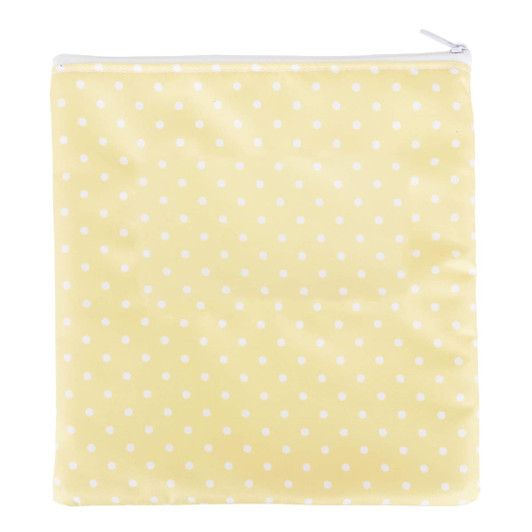 A reusable food pouch in a cheerful yellow with white polka dots and a zippered closure.