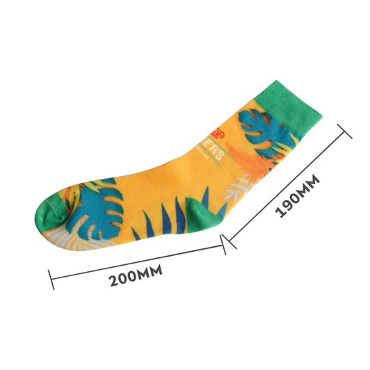 Bright yellow socks featuring tropical leaf prints in green and blue, with a contrasting green cuff.