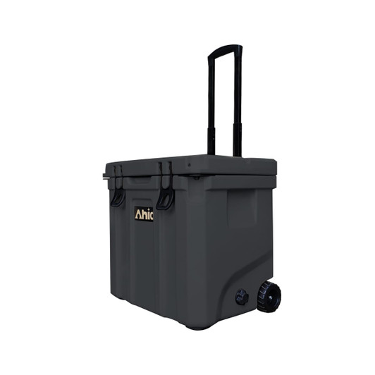 A grey cooler box with wheels and a retractable handle, featuring a logo on the front.