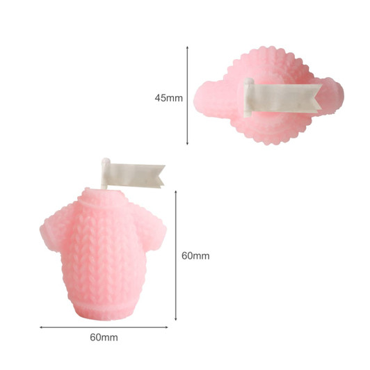 A pink sweater-shaped candle featuring a textured design and a small decorative flag. Measures 60mm tall and 45mm wide.