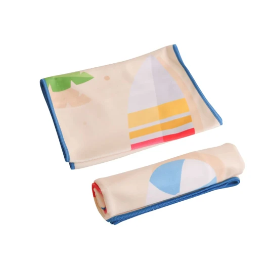 Microfibre beach towel in cream with colourful designs, featuring a surfboard and beach ball. Includes a logo.