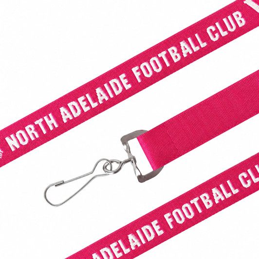 A pink woven lanyard with a metal clip and a logo, featuring text along its length.