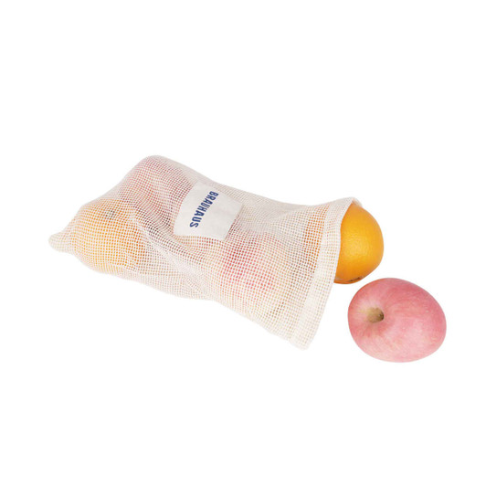 A cream-coloured organic cotton mesh bag containing oranges and a pink apple, with a logo visible.