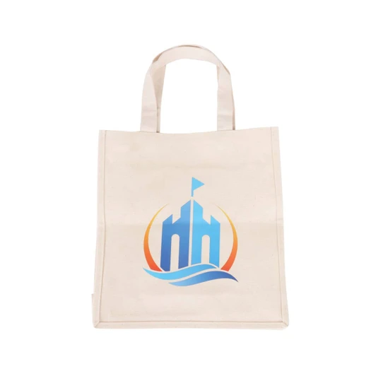 A cream-coloured cotton tote bag featuring a blue and orange logo. It has two sturdy handles for carrying.