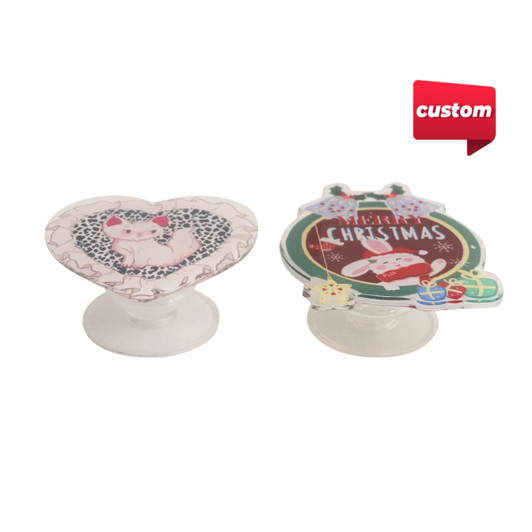 Custom shaped acrylic phone pop holders in heart and ornament designs, featuring a colourful Christmas theme.
