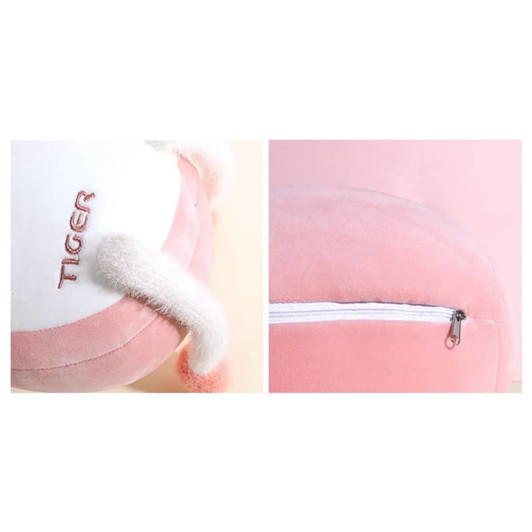 A plush, tiger-shaped travel pillow in pink and white, featuring small ears and a zippered section.
