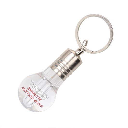 A light bulb-shaped flash drive in clear and silver, attached to a keyring. It features a small logo.