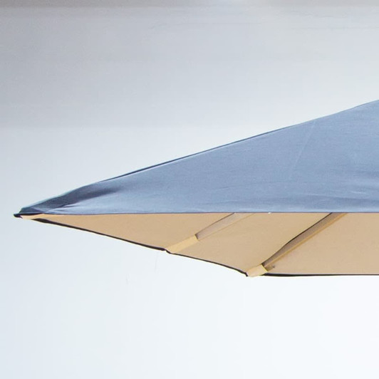 A square patio umbrella in dark blue and beige, featuring a sturdy frame and a branded logo.