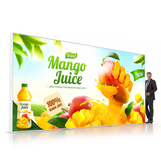 A backlit LED light box display features vibrant mango juice graphics and a drink bottle, with a person beside it for scale.