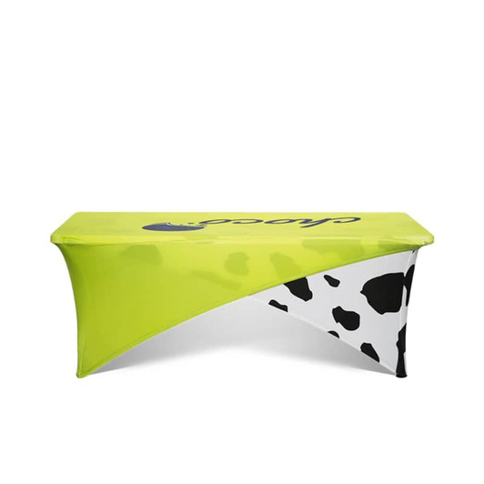 A bright lime green and black cow-patterned stretch tablecloth designed for an 8ft table, featuring a branding logo.