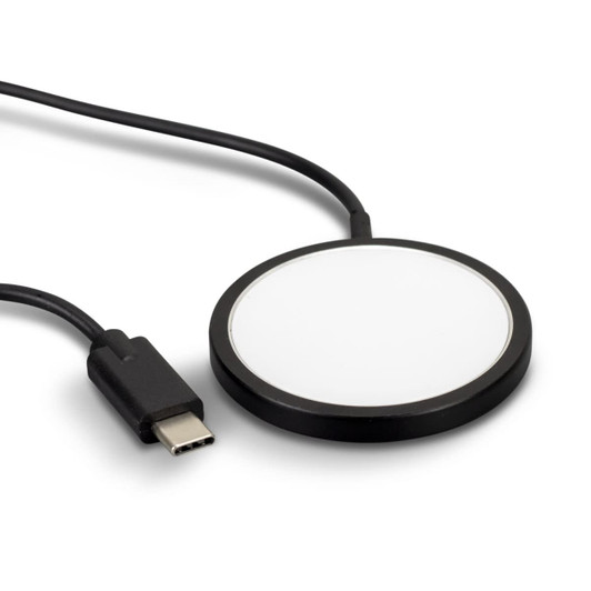 A black wireless charger with a circular design and a connected USB-C cable.