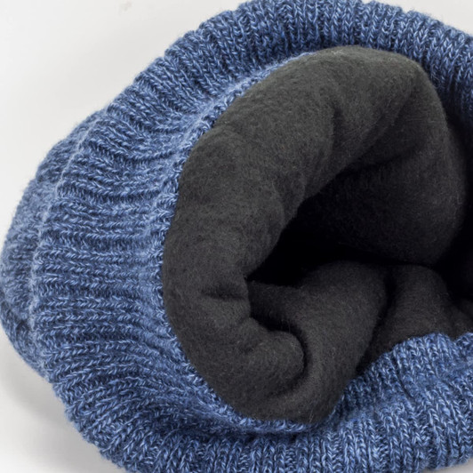 A blue beanie with a soft black lining, featuring a textured knit pattern and a logo.