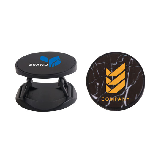 A round phone holder in black featuring two different logo designs on its surface.