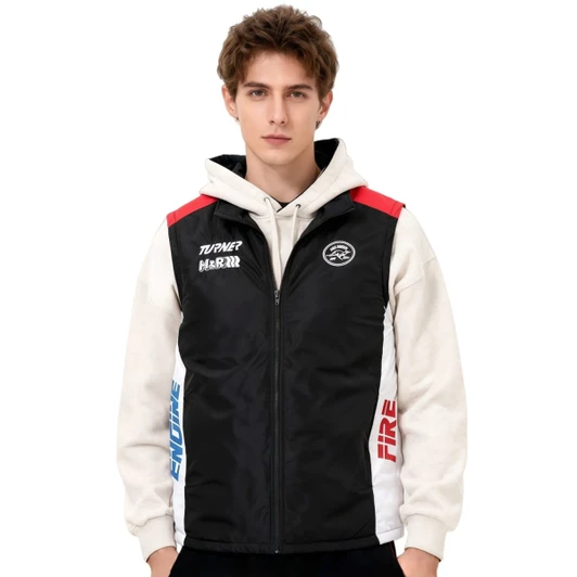 A man wearing a black, highly customised gilet with red, blue, and white accents, featuring branding.