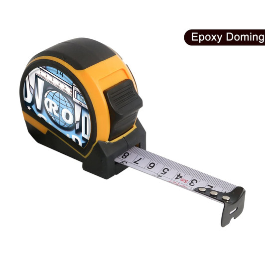 A tape measure in black and orange, featuring a retractable tape marked in metric units. It has a branded logo visible.