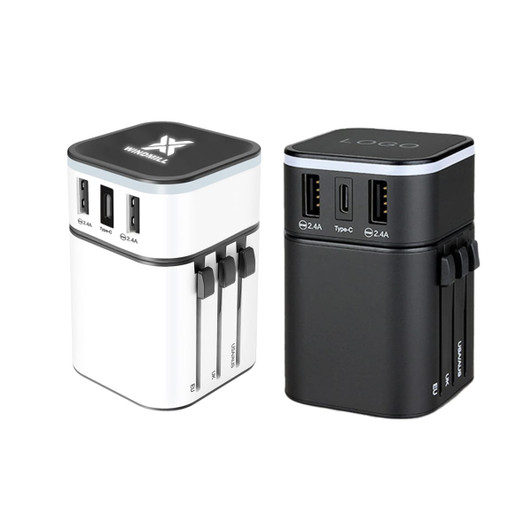 A Luminous Travel Adapter in white and black, featuring multiple USB ports and a logo on top.