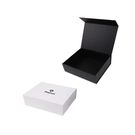 A black foldable magnetic box is partially open beside a white box with a logo. Both are designed for packaging.